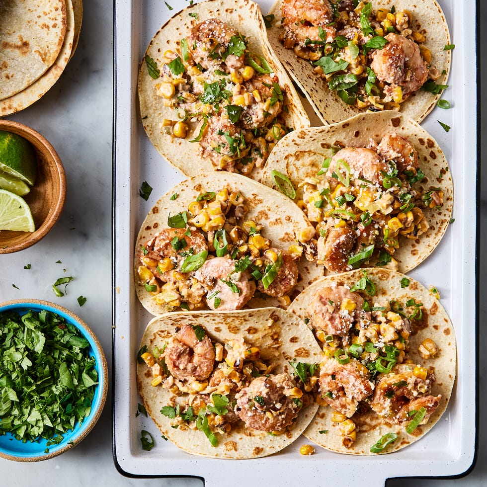 sweet corn is lightly browned in butter, then cooked with scallions, jalapeños, and garlic, tossed in chipotle chili powder and lime zest, then cooked alongside the corn before being smothered in a citrusy crema and topped with a flurry of cotija cheese and fresh cilantro