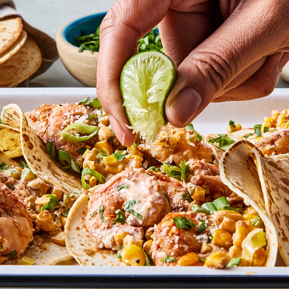 sweet corn is lightly browned in butter, then cooked with scallions, jalapeños, and garlic, tossed in chipotle chili powder and lime zest, then cooked alongside the corn before being smothered in a citrusy crema and topped with a flurry of cotija cheese and fresh cilantro