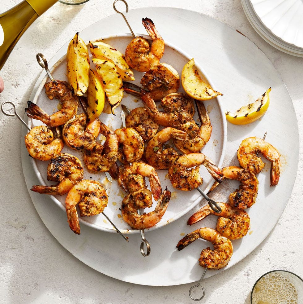 grilled shrimp kebabs on a white plate