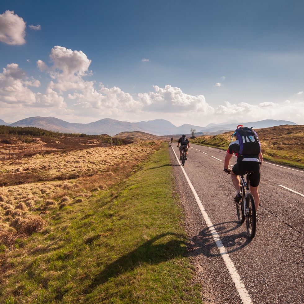fort william, scotland, uk   may 22, 2010 mountainbikers ride through the wilderness landscape of rannoch moor on the a82 road in the highlands of scotland shutterstock id 1185754378 hearst io number   project manager