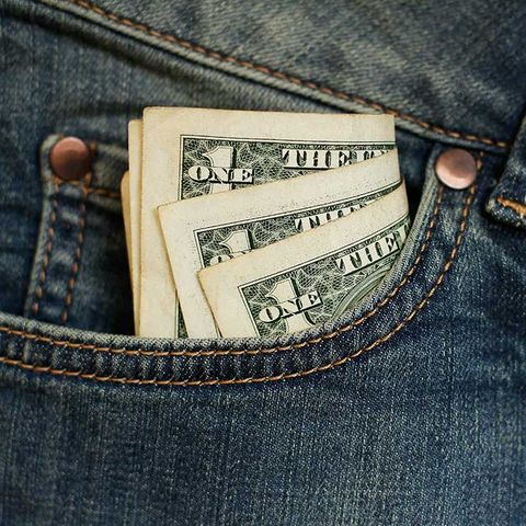 Dollar bills in pants pocket