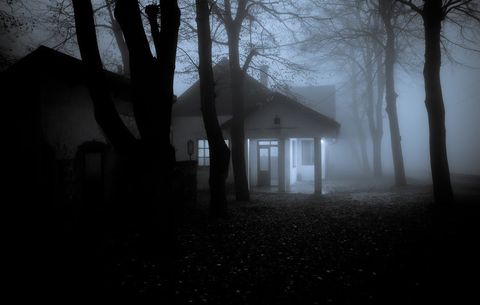 Creepy house surrounded by fog