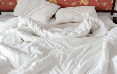 Bed with rumpled sheets