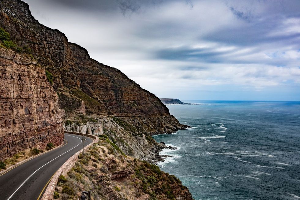 a road next to a cliff