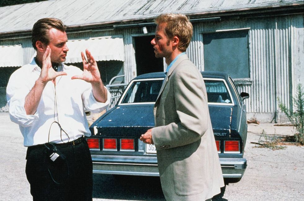 christopher nolan and guy pearce on the set of “memento” in 2000