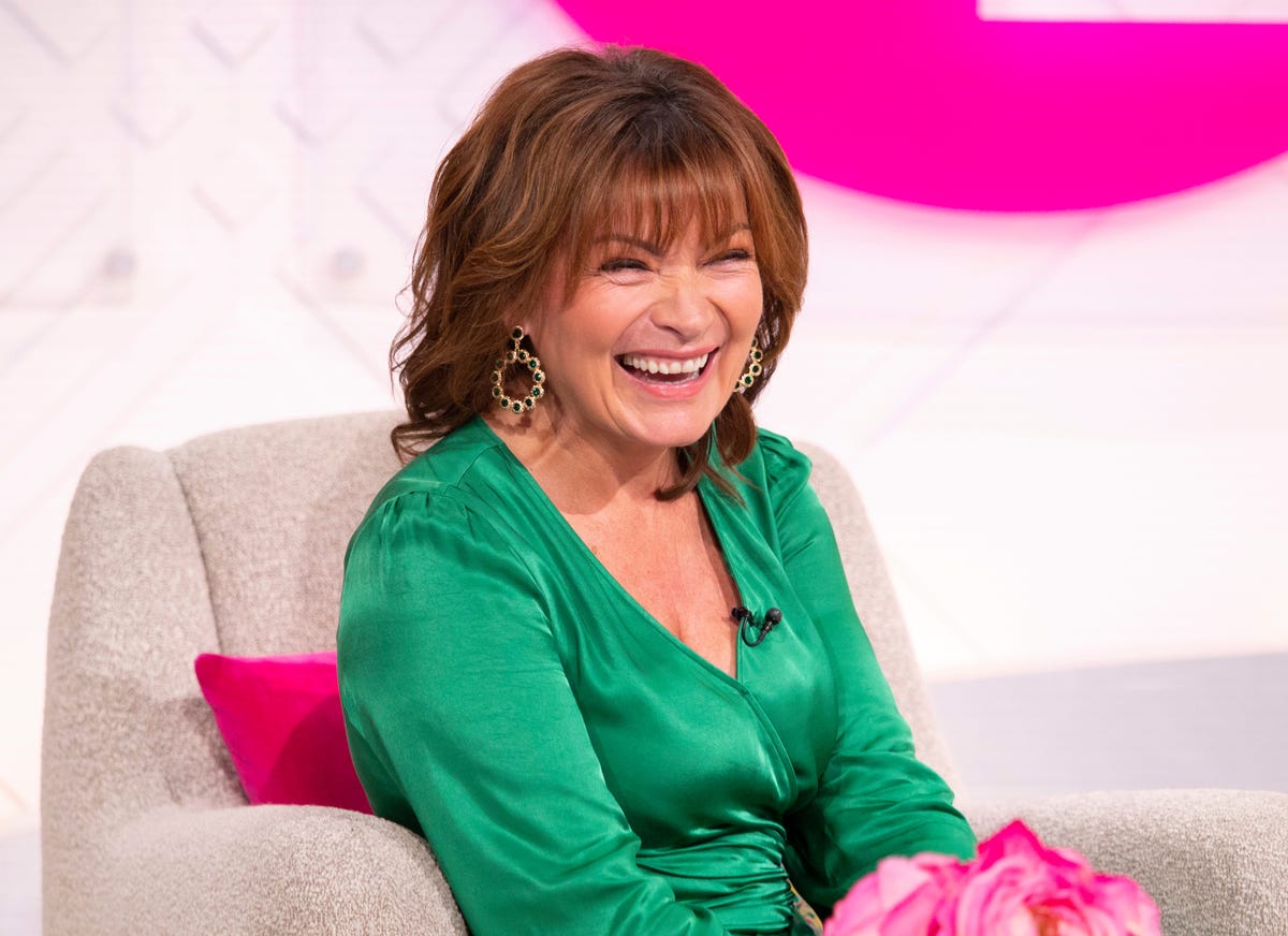 Lorraine glams up in green satin dress for anniversary show