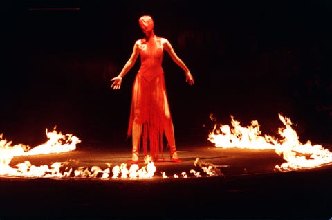 mandatory credit photo by alex lentatievening standardshutterstock 1119779a london fashion week a model wears red in his joan of arc theme in flames from the autumnwinter 199899 collection of alexander mcqueen london fashion week a model wears red in his joan of arc theme in flames from the autumnwinter 199899 collection of alexander mcqueen