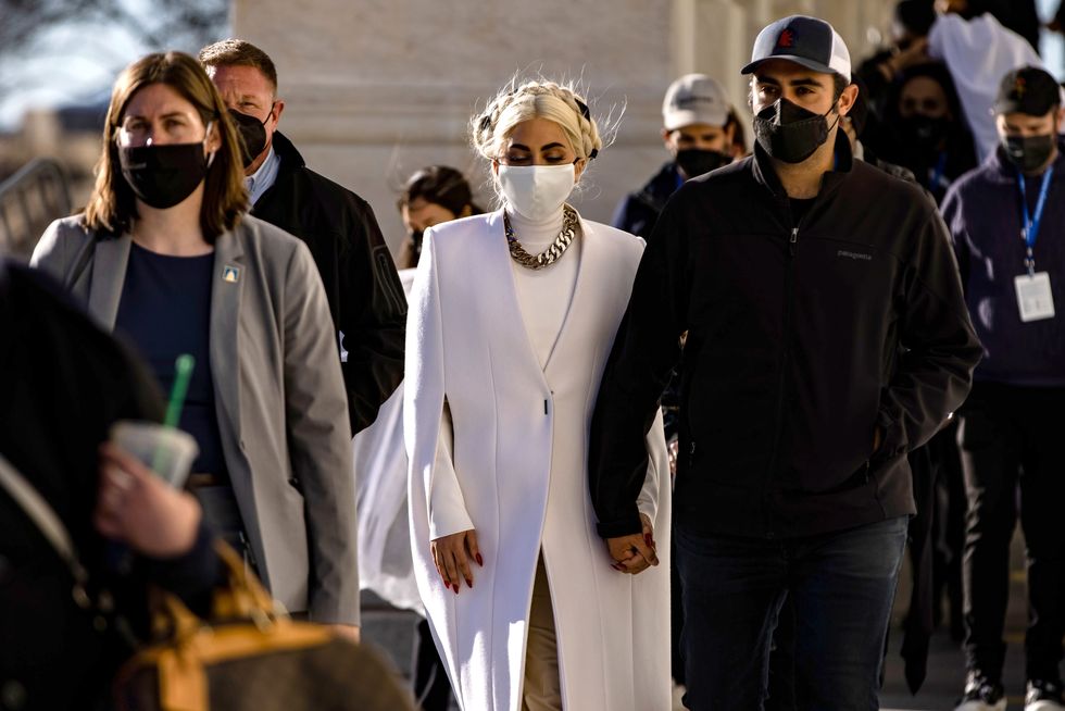 mandatory credit photo by samuel corumepa efeshutterstock 11717100qsinger and actress lady gaga leaves the us capitol building with her boyfriend michael polansky following an inauguration ceremony rehearsal in washington, dc, usa, 19 january 2021 jennifer lopez and lady gaga will be performing at the inauguration ceremony of joe biden as the 46th president of the united states on 20 januaryus capitol inauguration preparation, washington, usa   19 jan 2021