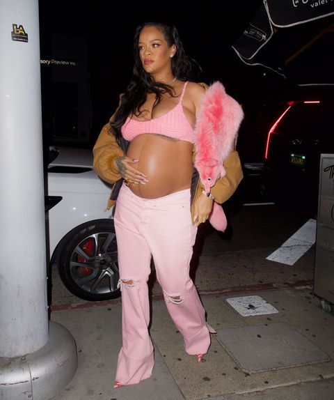 mandatory credit photo by diggzyshutterstock 12891363q
rihanna wore a pink faux fox across her shoulder as she arrived at the nice guy in hollywood she wore a pink bra top and a construction jacket as she made her way inside, gently cradling her growing baby bump
rihanna gently cradles her baby bump as she arrives at the nice guy to celebrate her bff melissa fordes birthday, los angeles, california, usa   12 apr 2022
wearing r13, jacket, wearing bottega veneta, top, wearing vetements, jeans