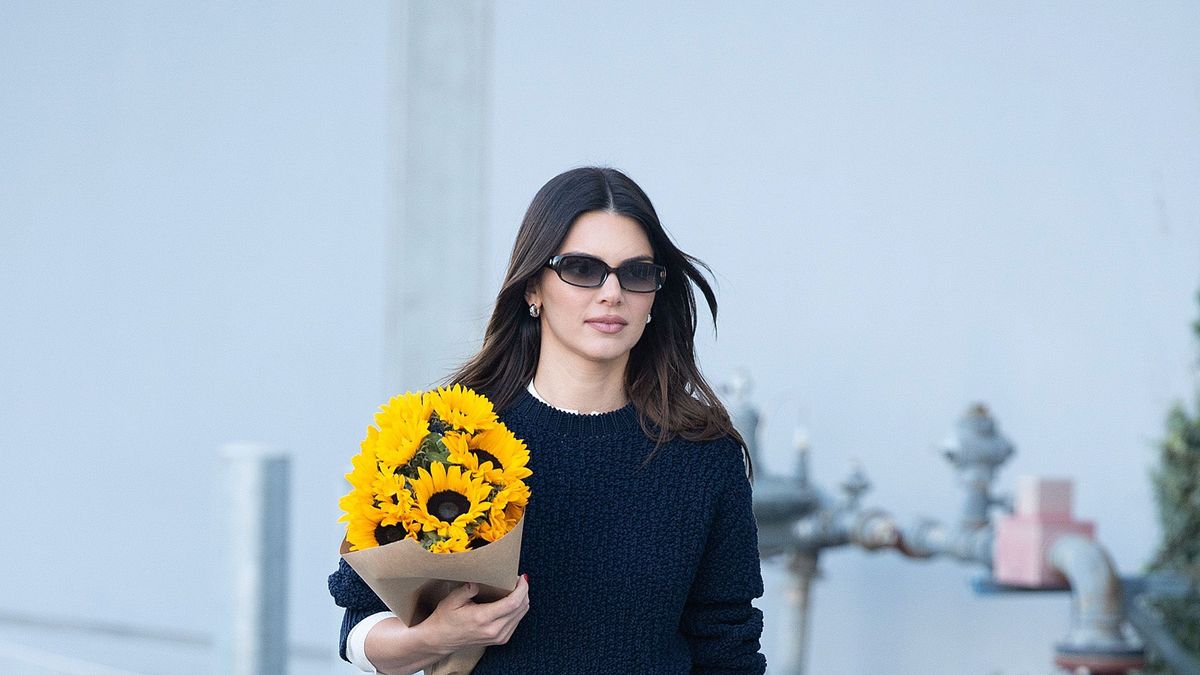 Kendall Jenner is stylishly casual in a floral knit sweater and