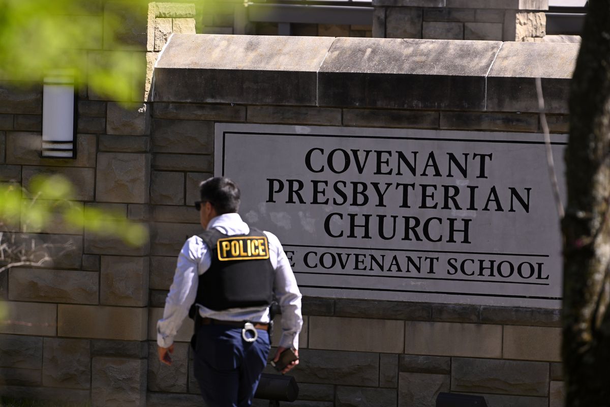 mandatory credit photo by john amisapshutterstock 13847481c police officer walks by an entrance to the covenant school after a shooting in nashville, tenn on school shooting, nashville, united states 27 mar 2023
