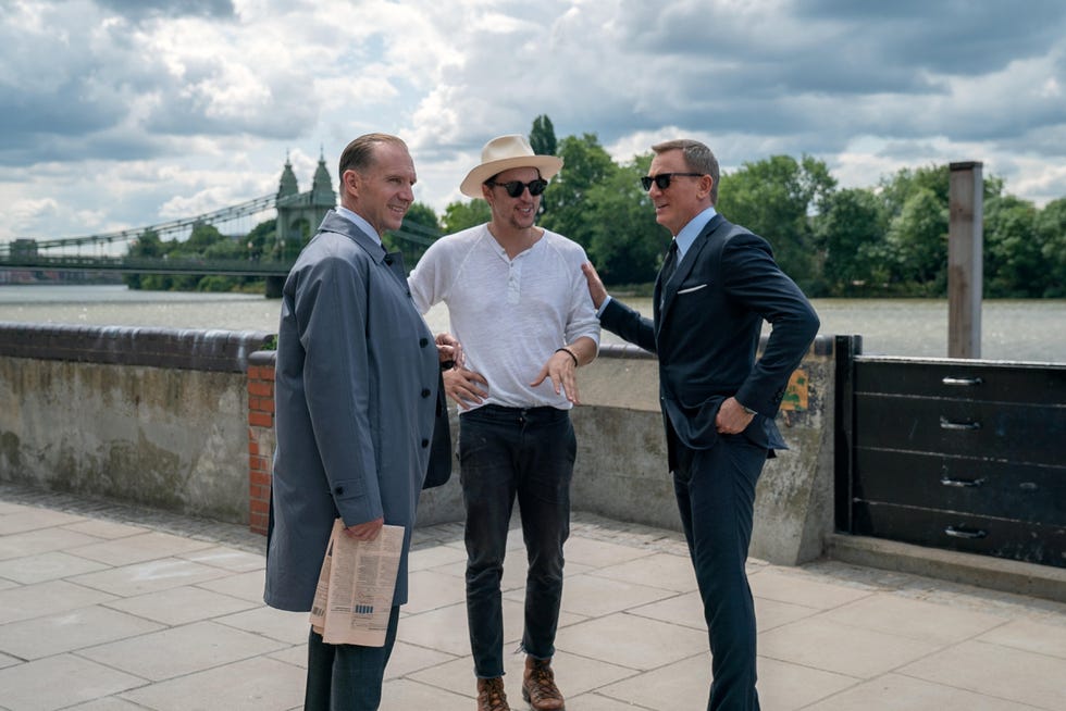 for editorial use only mandatory credit: photo by nicola dove/mgm/tha/shutterstock (13967941s) ralph fiennes (m), director cary joji fukunaga and daniel craig (james bond) on the set of no time to die (2021), an eon productions and metro goldwyn mayer studios film. photo credit: nicola dove / mgm / the hollywood archive no time to die (2021)