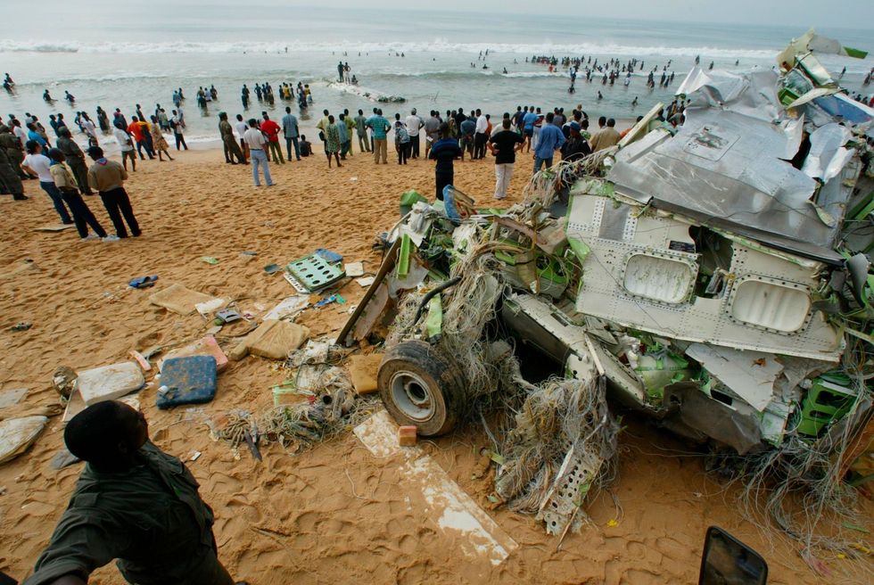 mandatory credit photo by saurabh dasapshutterstock 7094939a
plane crash rescue teams look for bodies and the black box flight recorder at cotonou, benin, after a boeing 727 bound for lebanon crashed just after take off, killing at least 130 of the 161 people on board, on christmas, dec 25 american authorities are investigating whether the boeing 727 was the same jet that vanished in angola last year, setting off a worldwide search, a us state department spokesman said friday, jan 2, 2004
africa mystery plane, cotonou, benin