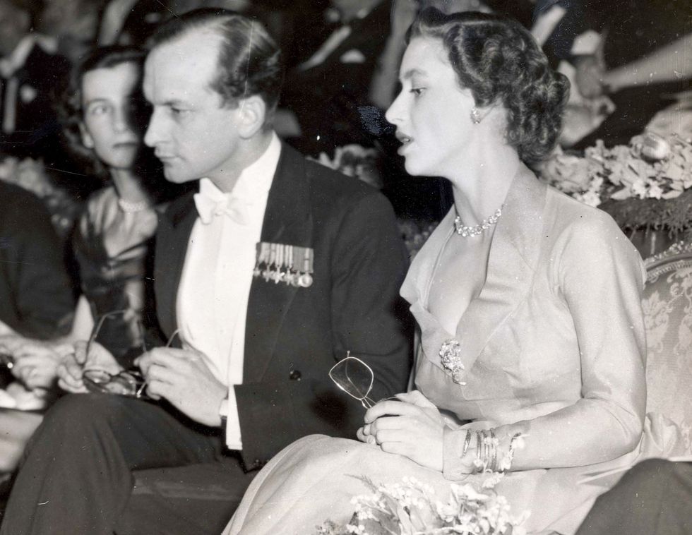 Princess Margaret 22nd Febuary 1954 Princess Margaret With Mark Bonham Carter At Premiere Of 'kiss Me Kate' The New 3.d. Film At The Empire Leicester Square. In Apricot Silk Organaza A Diamond Necklace. Last Night She Became The First Member Of The