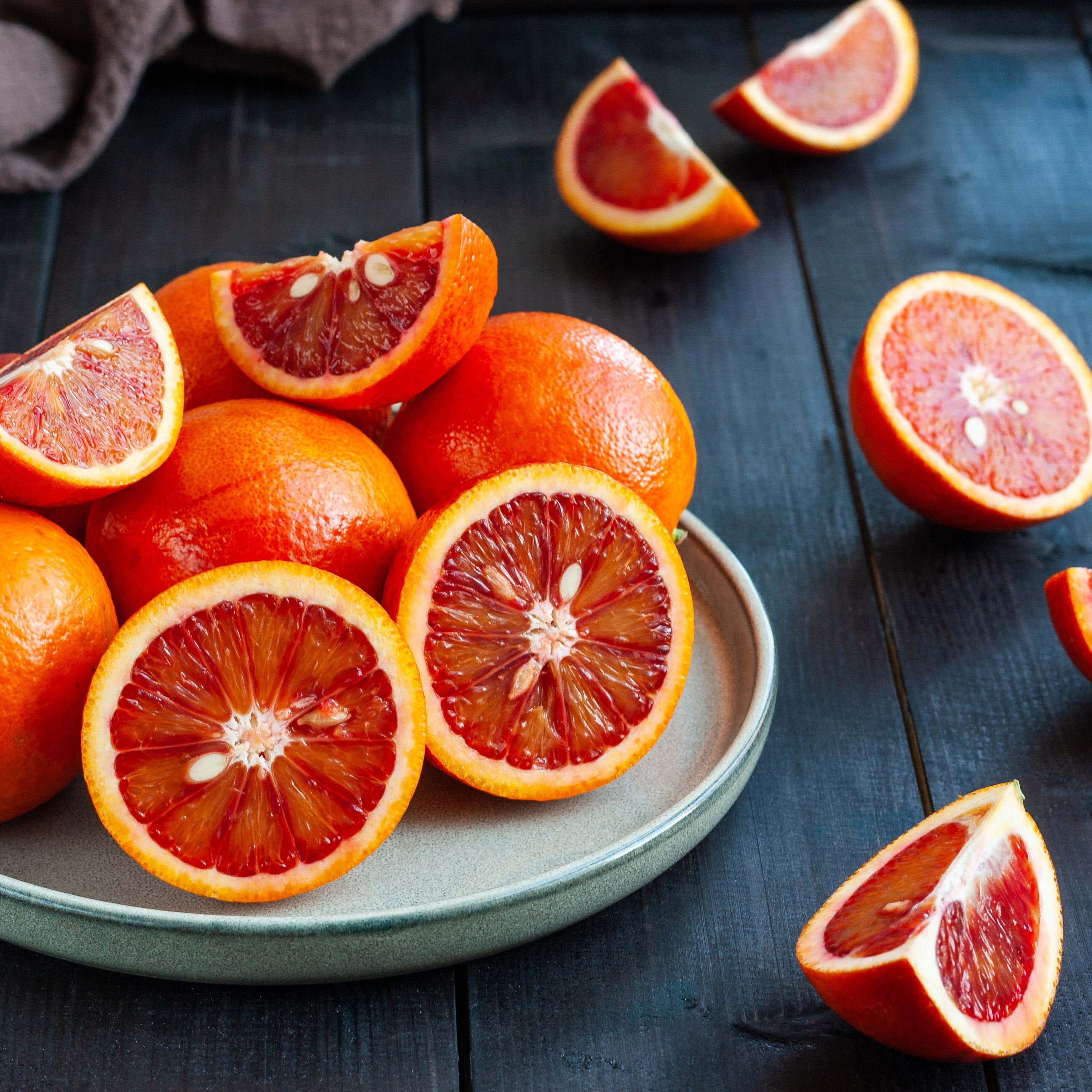 sicilian blood oranges on dark background