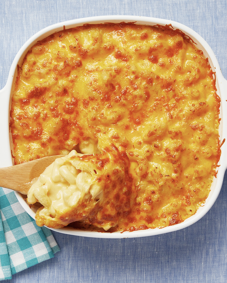 macaroni and cheese with wooden spoon