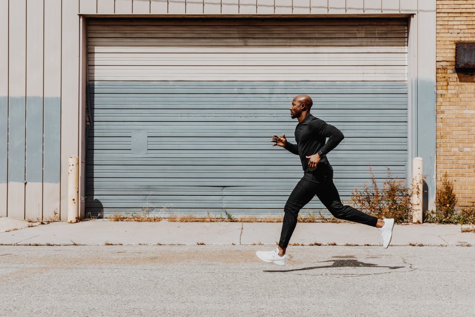 facet look of man jogging in city