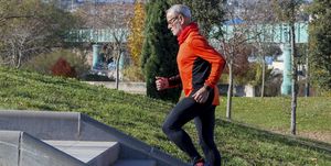 Side View Of Senior Man Running On Steps In Park