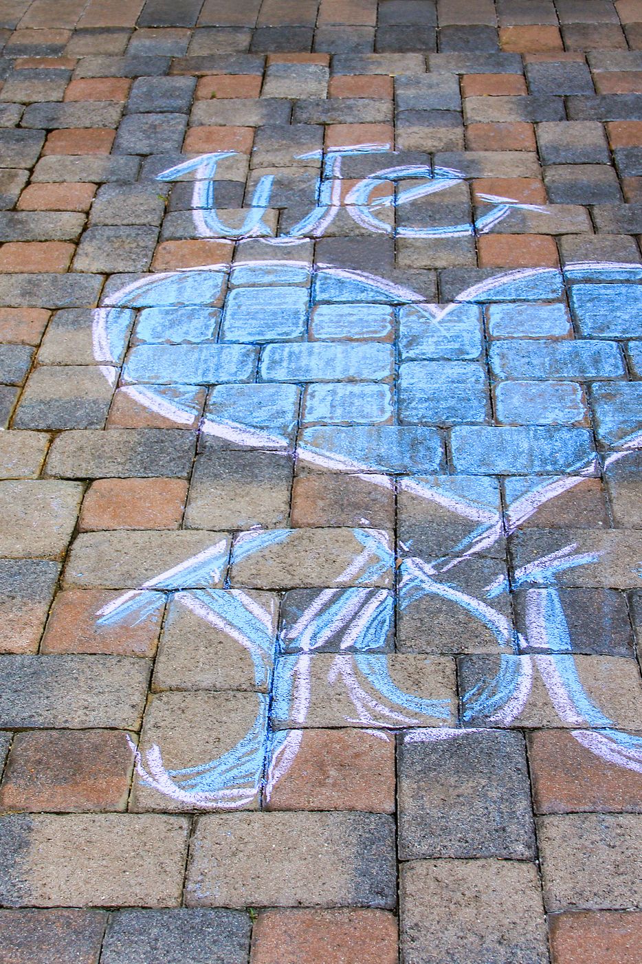 Sidewalk pavement with chalk message