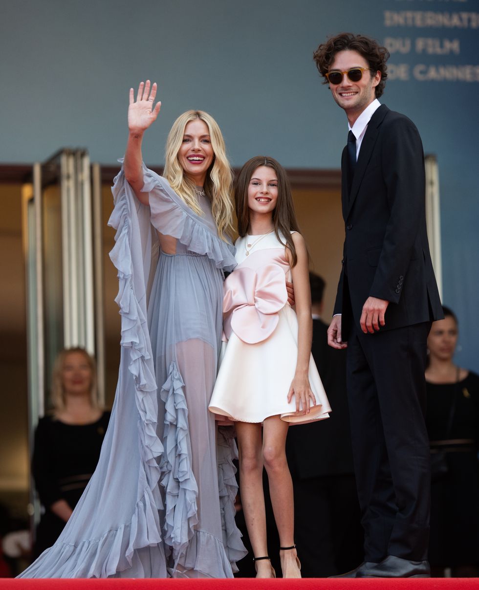 cannes, france may 19 sienna miller, marlowe sturridge and oli green attend the horizon an american saga red carpet at the 77th annual cannes film festival at palais des festivals on may 19, 2024 in cannes, france photo by samir husseinwireimage