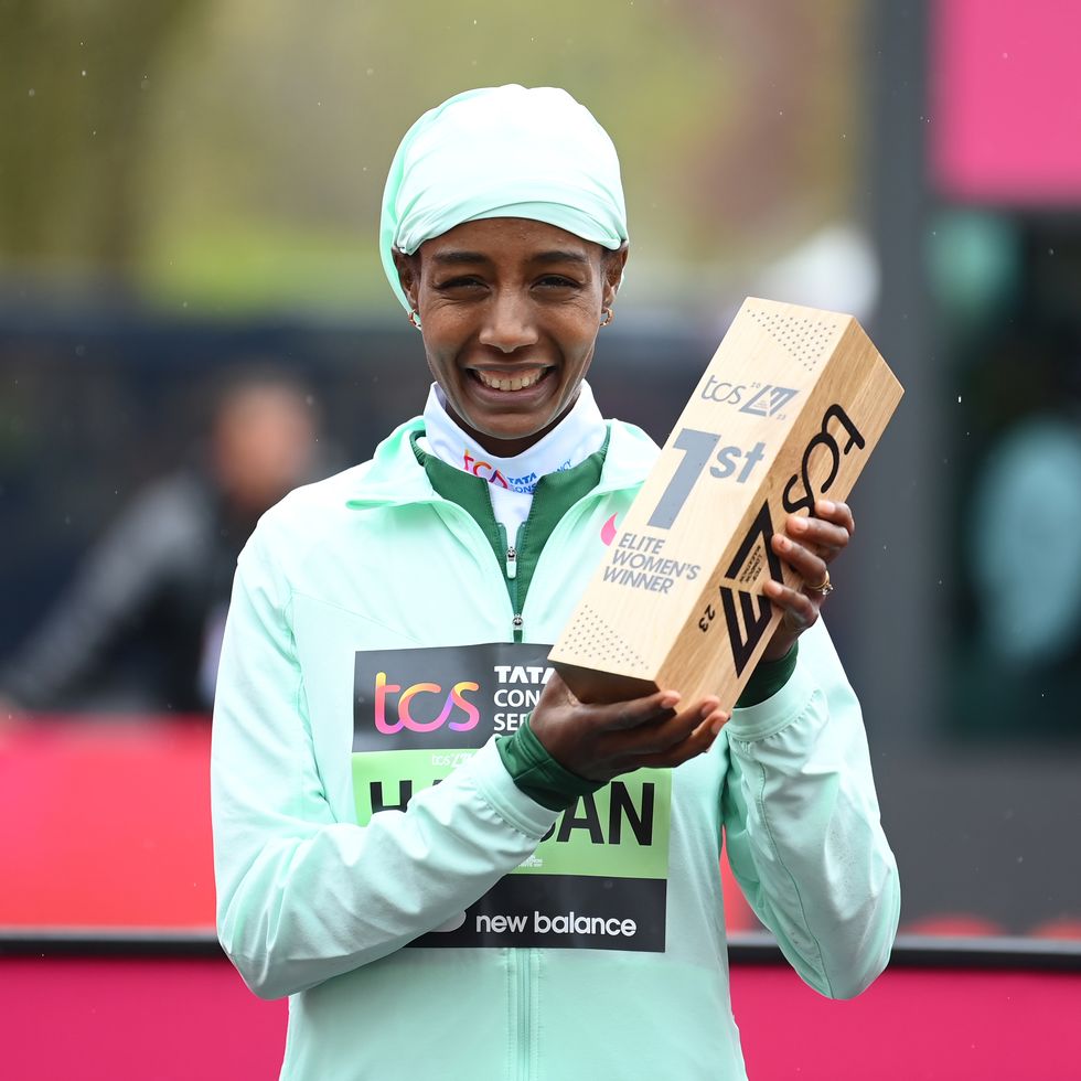 london, england april 23 sifan hassan of netherlands poses for a photo with their trophy after winning the elite womans marathon during the 2023 tcs london marathon on april 23, 2023 in london