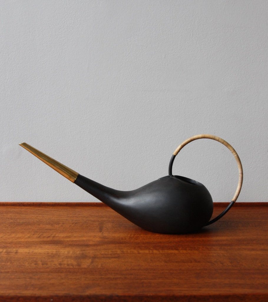 a vintage carl aubock watering can