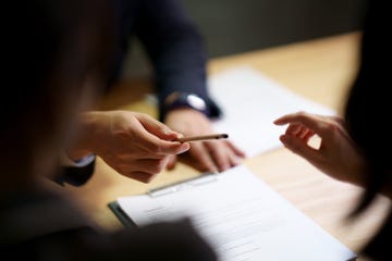 signing a contract agreement after negotating a car lease