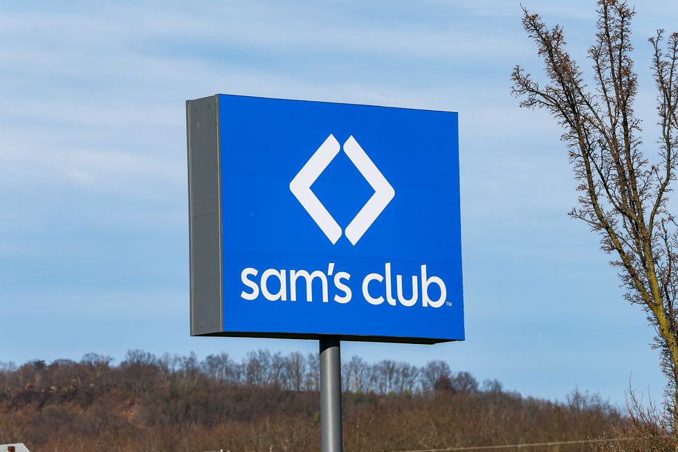 a sign for sam's club is seen at the entrance to the members...