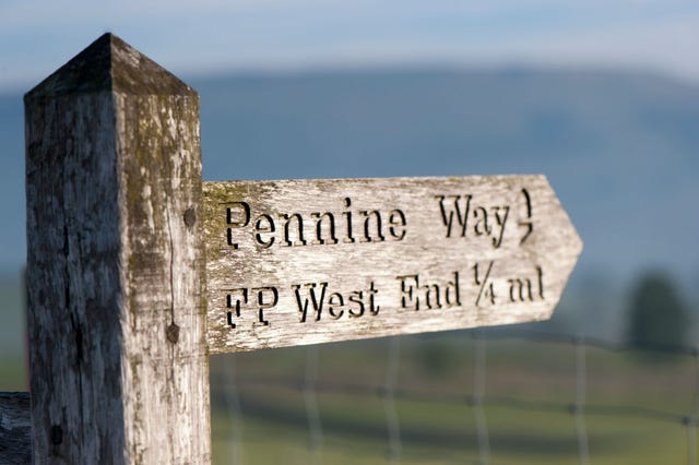 sign post near hawes, north yorkshire, pointing direction of the pennine way uk