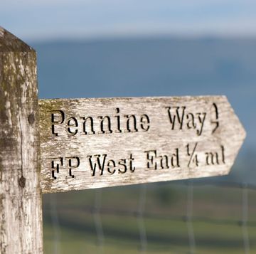 sign post near hawes, north yorkshire, pointing direction of the pennine way uk