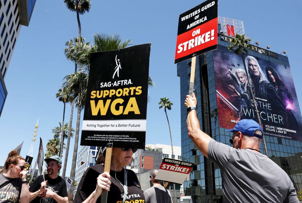 sag aftra union members join writers picket line at netflix headquarters