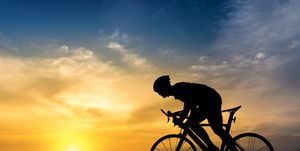Silhouette Man Riding Bicycle Against Sky During Sunset