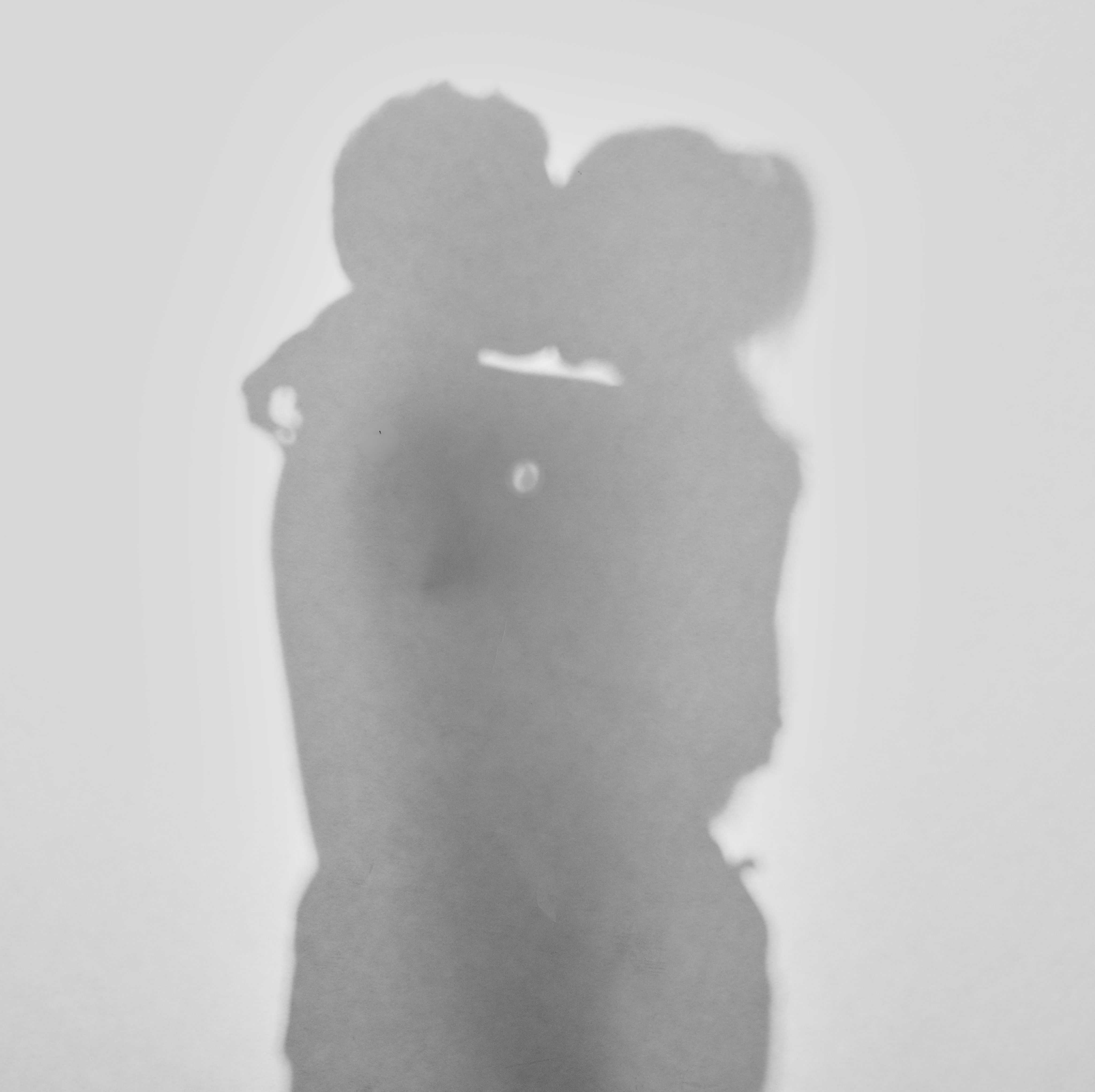 silhouette of a couple man and woman kissing