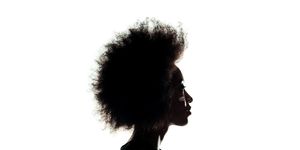 silhouette of african american woman with afro hairstyle isolated on white