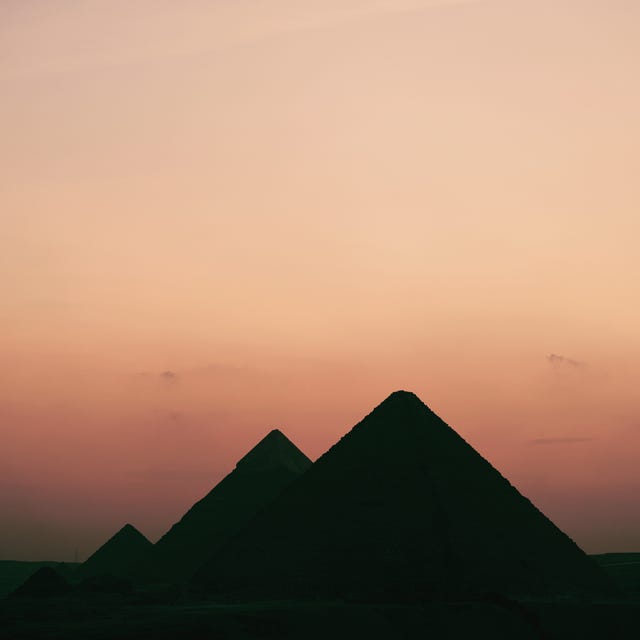 silhouette of built structure against sky during sunset