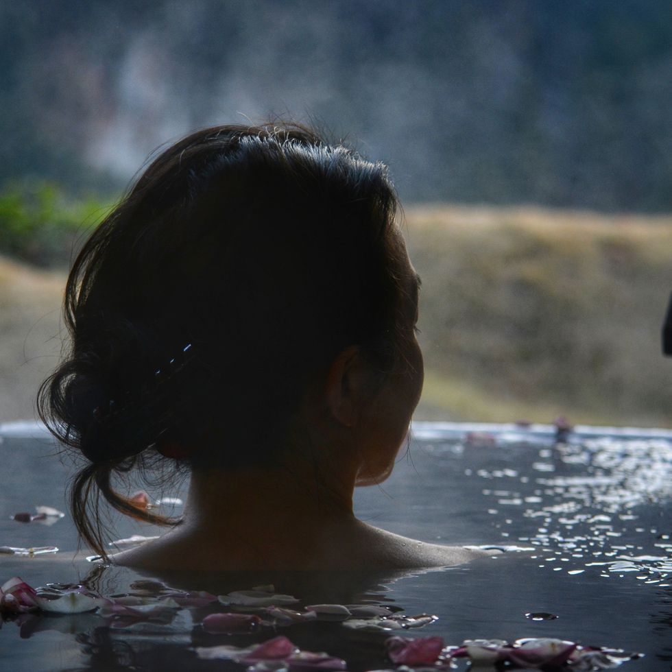 silhouette of woman's head in hotspring