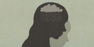 silhouette sad woman with rain clouds in head