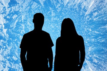 silhouettes of two people against a frosty blue background