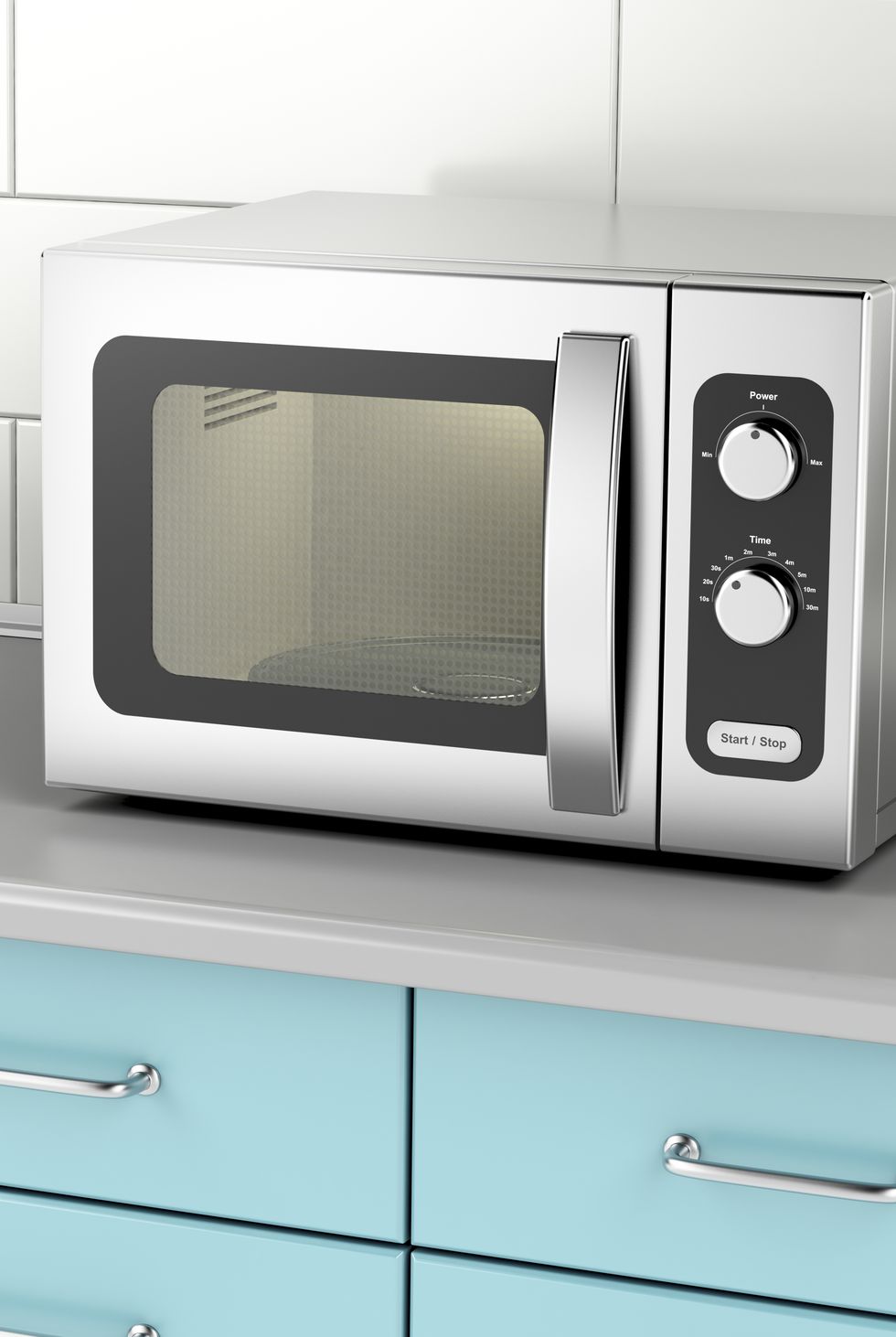 silver microwave oven on light blue counter