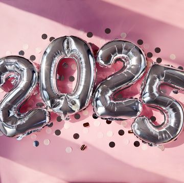 silver numbers 2025 two thousand twenty five new year balloons in sunlight pink background