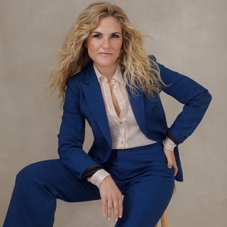 a woman in a blue suit