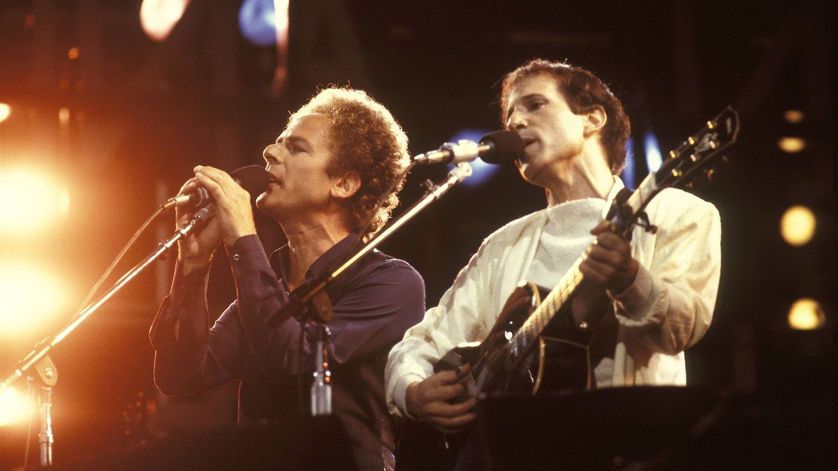 Paul Simon and Art Garfunkel perform live on stage at Wembley Stadium in London on June 19, 1982