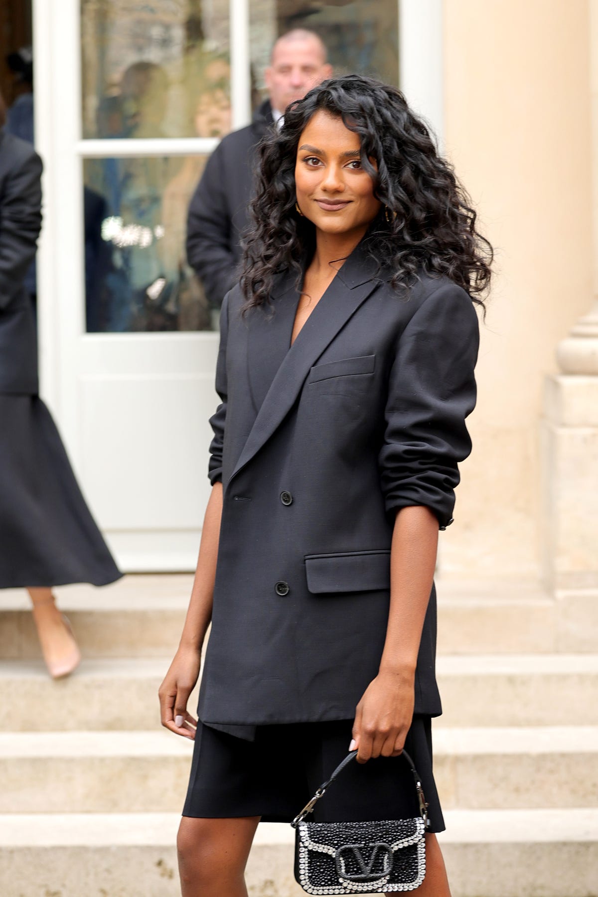 Simone Ashley wears tailoring to Paris Fashion Week