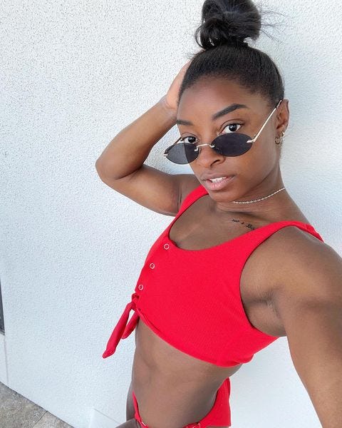 Simone Biles Wears an Orange Gingham Corset Top on Instagram