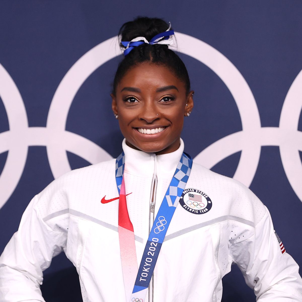 Gymnastics - Artistic - Olympics: Day 11TOKYO, JAPAN - AUGUST 03: Simone Biles of Team United States poses with the bronze medal following the Women's Balance Beam Final on day eleven of the Tokyo 2020 Olympic Games at Ariake Gymnastics Centre on August 03, 2021 in Tokyo, Japan. (Photo by Laurence Griffiths/Getty Images)
