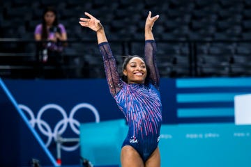 simone biles raises her hands during a gymnastics training session in the paris 2024 olympics games on july 25, 2024