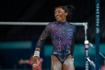 simone biles of the united states reacts after performing her uneven bars routine during artistic gymnastics podium training at the bercy arena in preparation for the paris 2024 summer olympic games