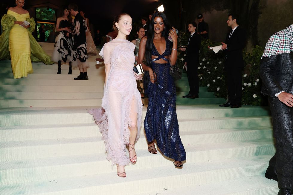 new york, new york may 06 l r phoebe dynevor and simone ashley attend the 2024 met gala celebrating sleeping beauties reawakening fashion at the metropolitan museum of art on may 06, 2024 in new york city photo by cindy ordmg24getty images for the met museumvogue