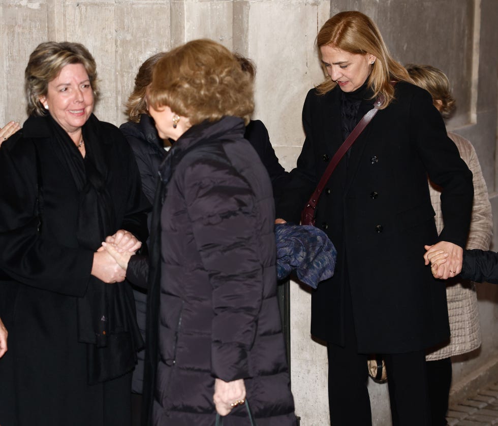a group of women standing next to each other