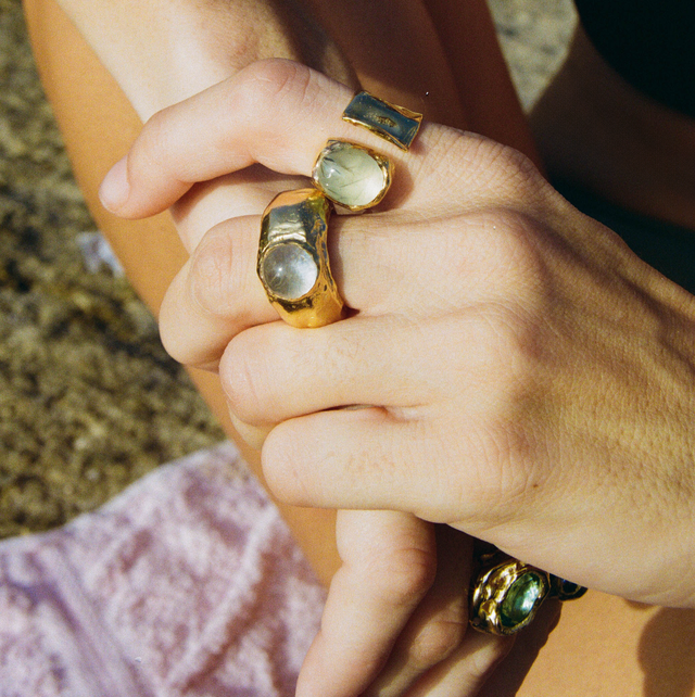 a person holding a pair of rings